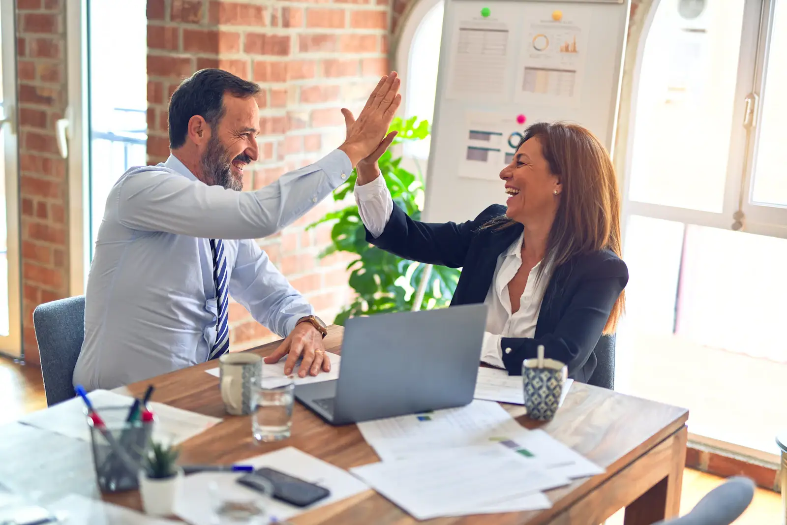 Loan advisors celebrating a closing